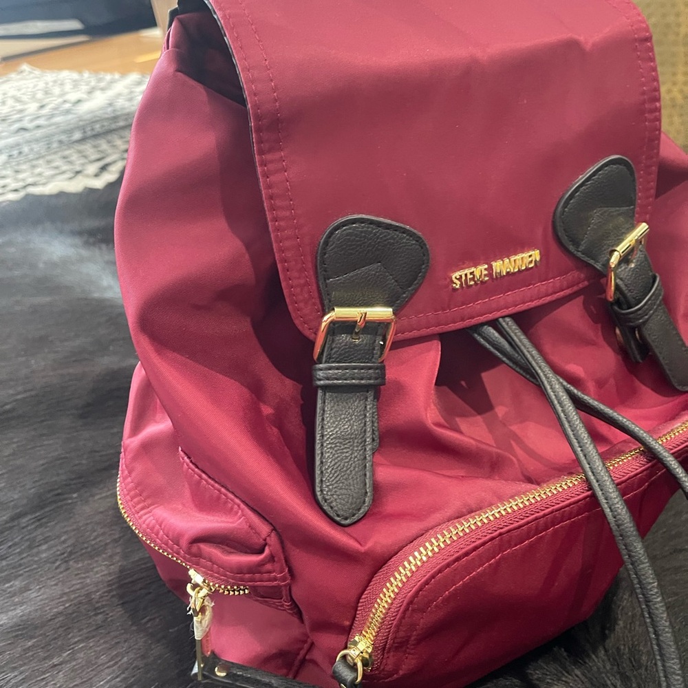 Steve Madden Wine Red Backpack with Black and Gold Accents